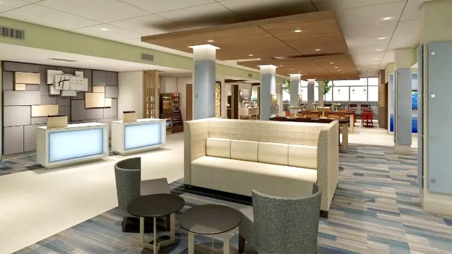 Spacious hotel front desk lobby with reception desk and conversational seating